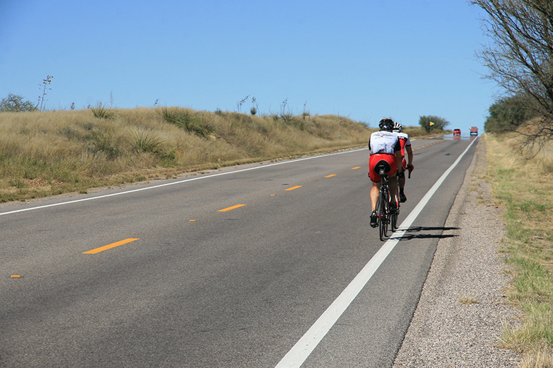 Bicyclist riding on the shoulder of a road